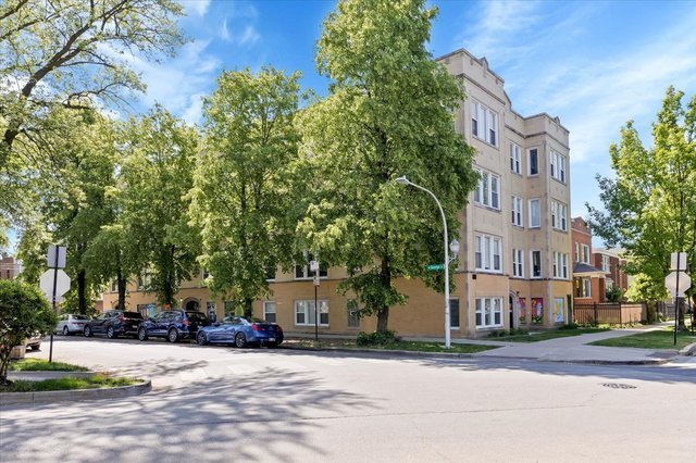 3317 West George Street, Unit 2 Chicago, IL 60618 - Photo 3 of 15 a city street lined with buildings and trees