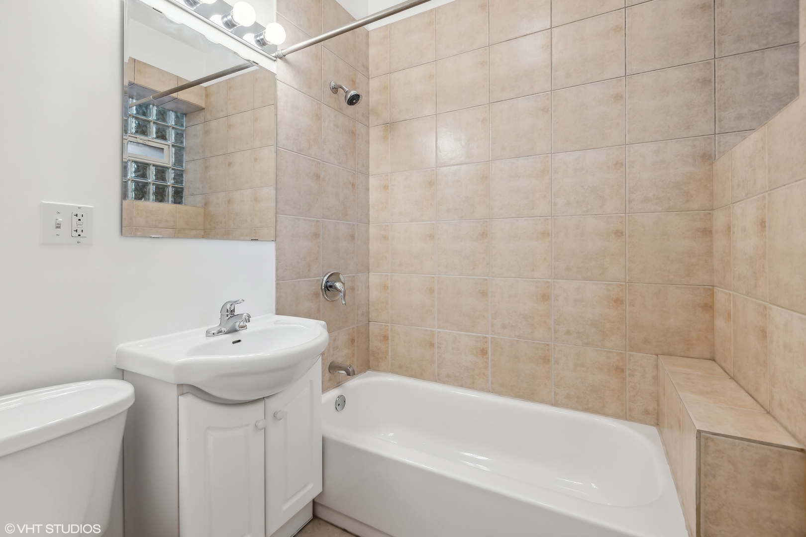 3317 West George Street, Unit 2 Chicago, IL 60618 - Photo 10 of 15 a bathroom with a sink a toilet and shower