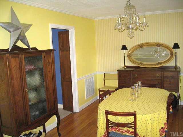 Formal dining room with chair rail, double window, & hardwoods Other
