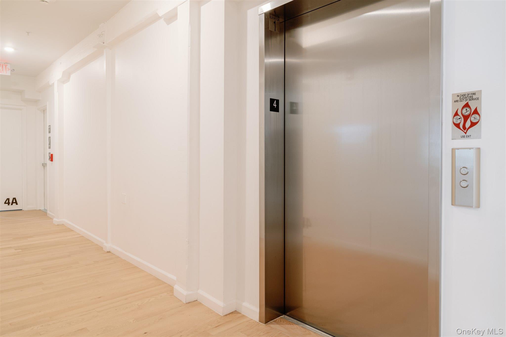 155 River Street, Unit BA Troy, NY 12180 - Photo 16 of 26 Hallway with elevator and wood finished floors
