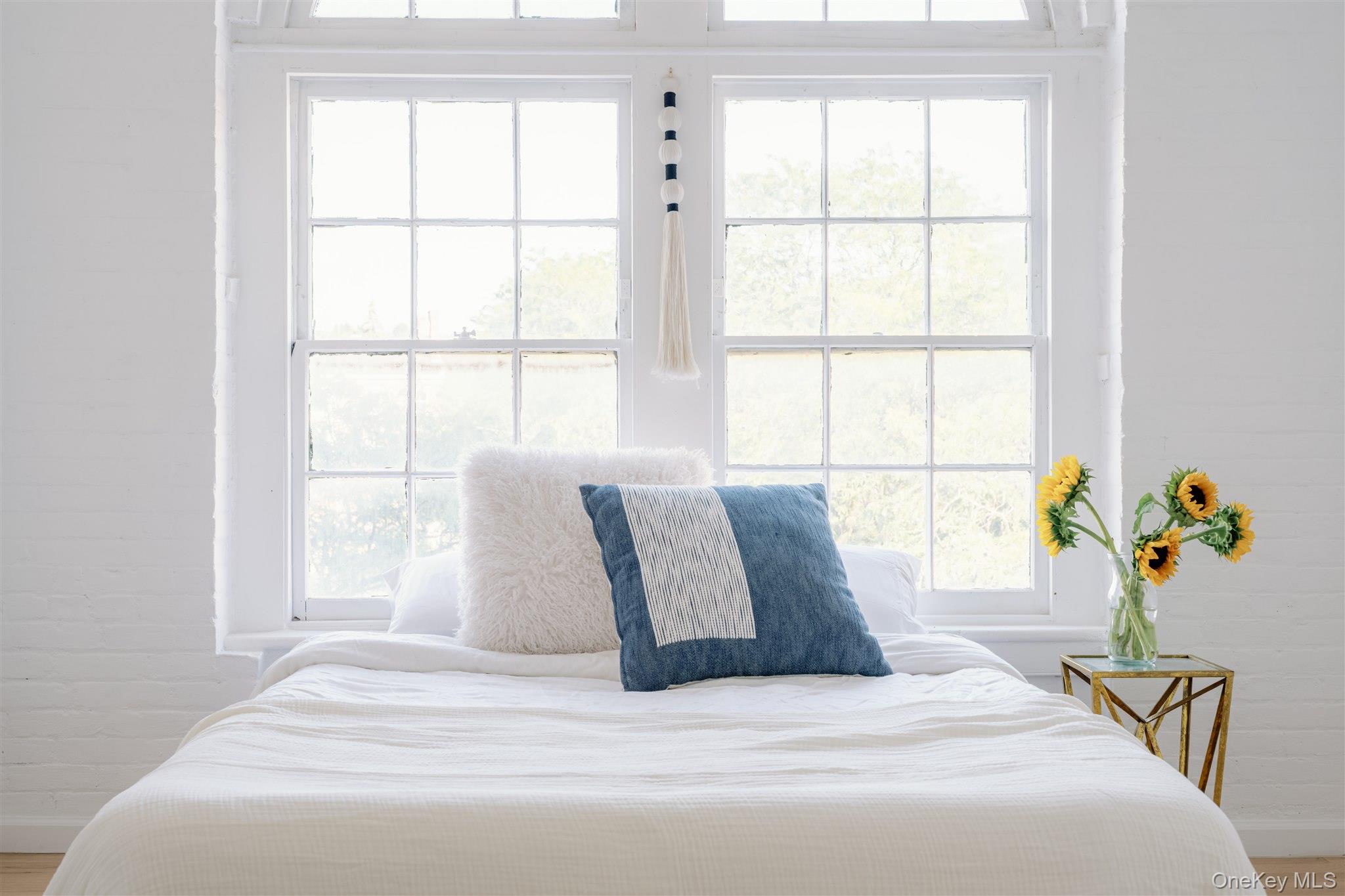 155 River Street, Unit BA Troy, NY 12180 - Photo 25 of 26 Bedroom featuring multiple windows and wood finished floors