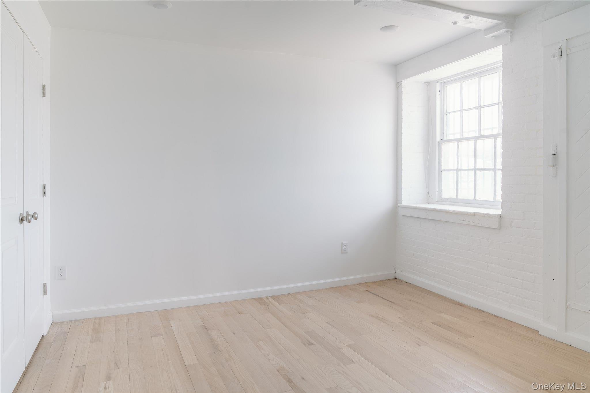 155 River Street, Unit BA Troy, NY 12180 - Photo 4 of 26 Spare room with light wood finished floors and baseboards