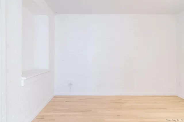 an empty room with a bench