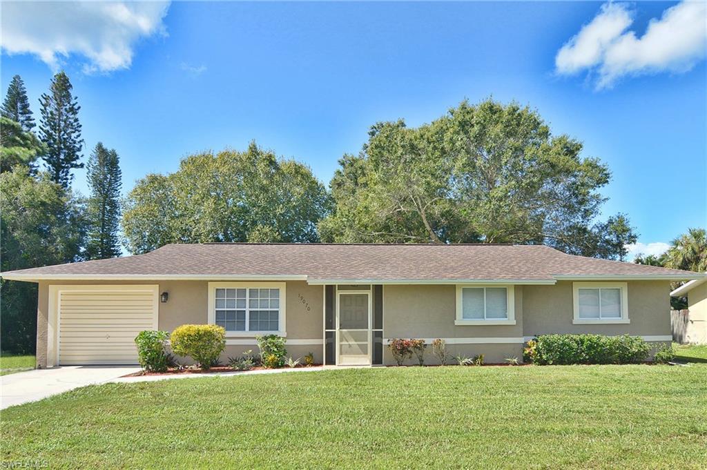 19070 Evergreen Road Fort Myers, FL 33967 - Photo 1 of 25 a front view of a house with a yard
