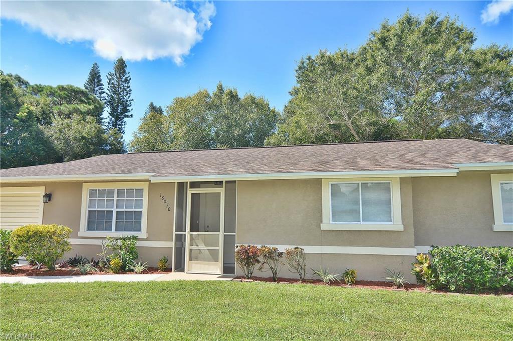 19070 Evergreen Road Fort Myers, FL 33967 - Photo 2 of 25 front view of a house with a yard