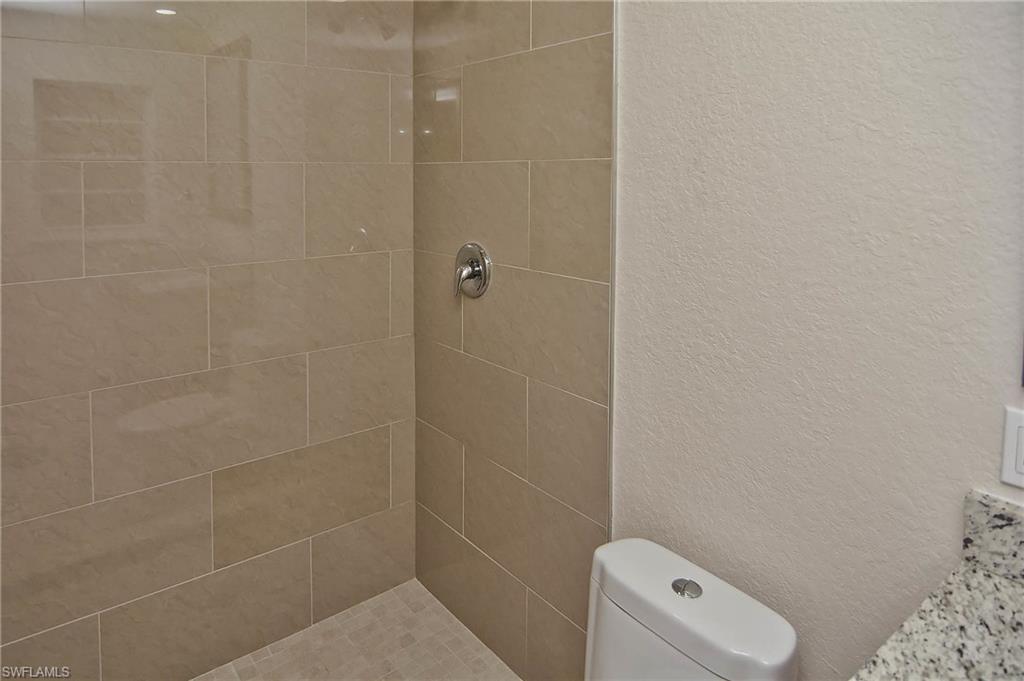 19070 Evergreen Road Fort Myers, FL 33967 - Photo 10 of 25 a bathroom with a toilet and a shower