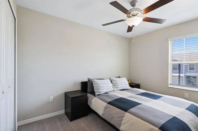 a bedroom with a bed and window