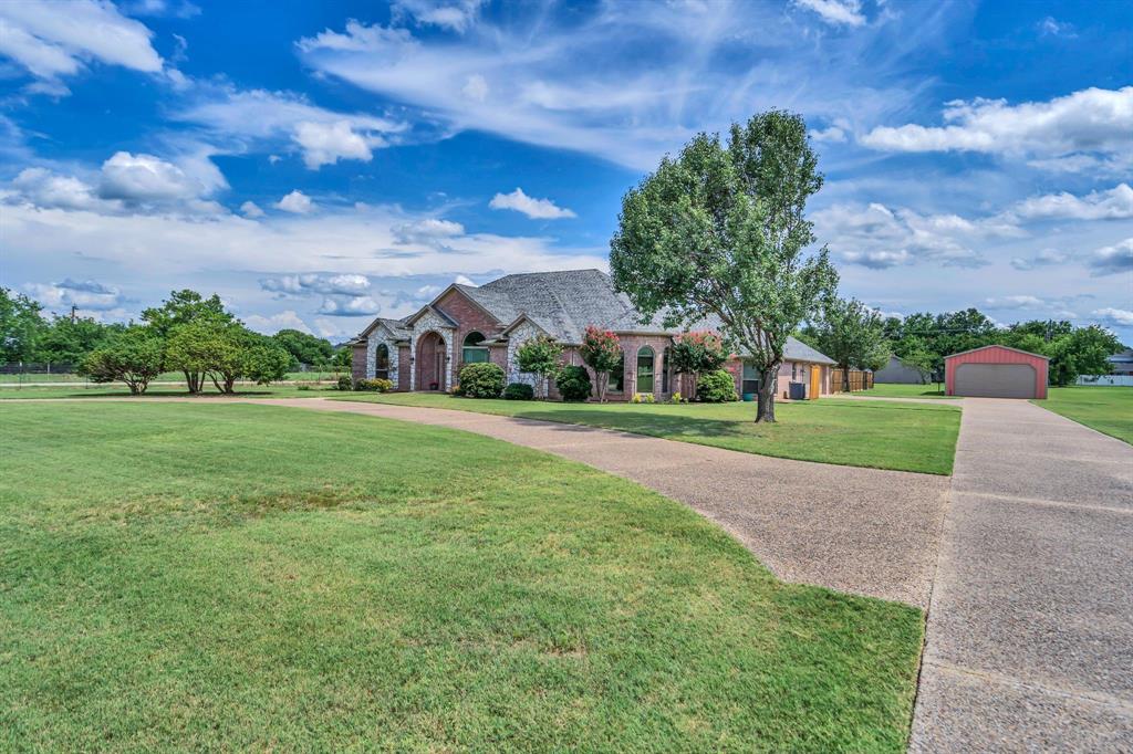 50 Buckingham Lane Allen, TX 75002 - Photo 5 of 39 French country style house with a detached garage, an outbuilding, a front yard, stone siding, and driveway