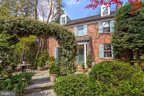 front view of a house with a tree