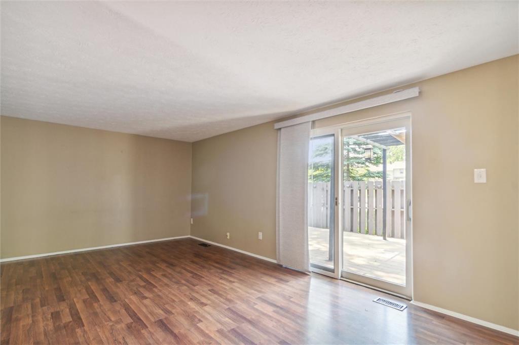 310 Ridge Point Circle Bridgeville, PA 15017 - Photo 11 of 24 a view of an empty room with wooden floor and a window
