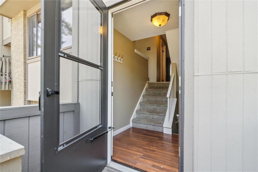 310 Ridge Point Circle Bridgeville, PA 15017 - Photo 3 of 24 a view of a hallway with wooden floor and staircase