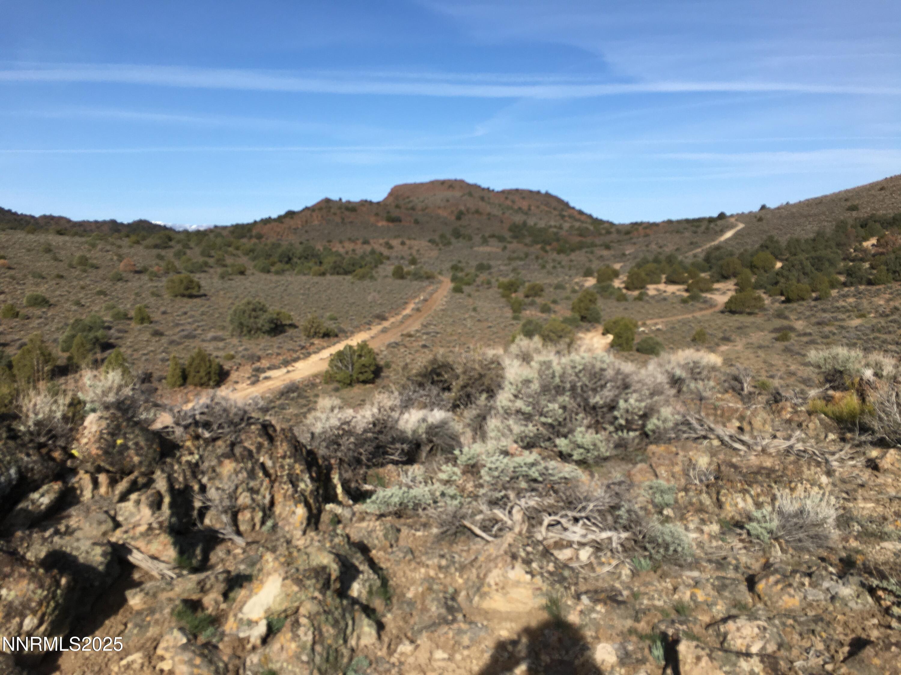 30 South Virginia Street, Unit LOT 30 S Reno, NV 89521 - Photo 1 of 8 a view of a large mountain with mountains in the background