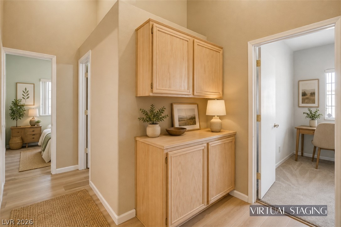 811 Rio Poco Court Henderson, NV 89015 - Photo 9 of 40 High ceilings and built-in wood cabinetry anchor this versatile hallway transition space.