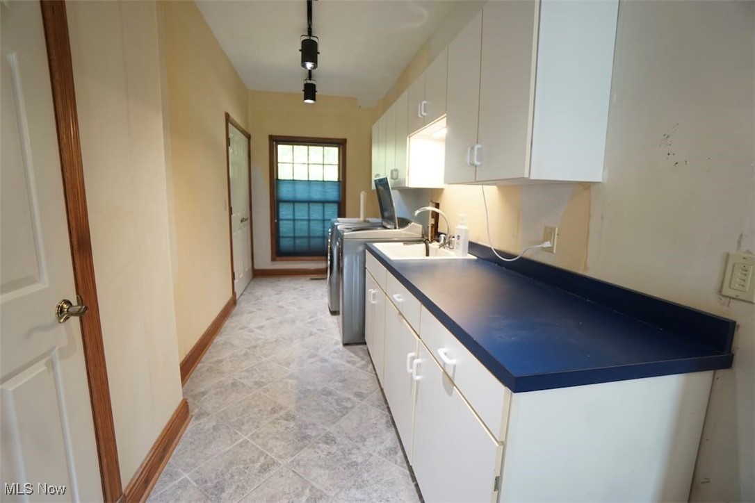 7060 Gates Road Gates Mills, OH 44040 - Photo 18 of 38 Laundry room with cabinet space and washer and clothes dryer