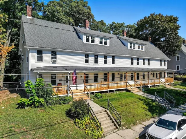 a aerial view of a house with a yard