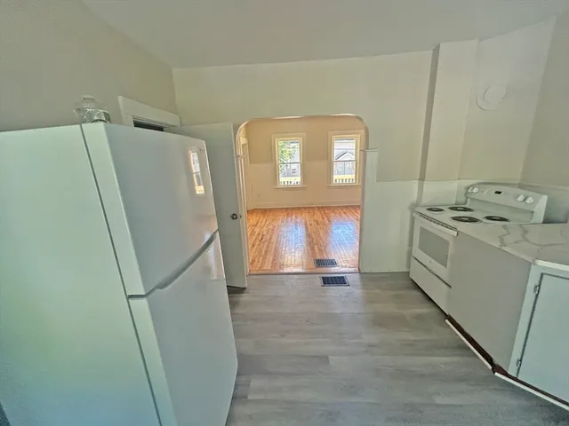 a view of a storage and utility room with a washer dryer