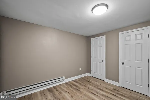 an empty room with wooden floor