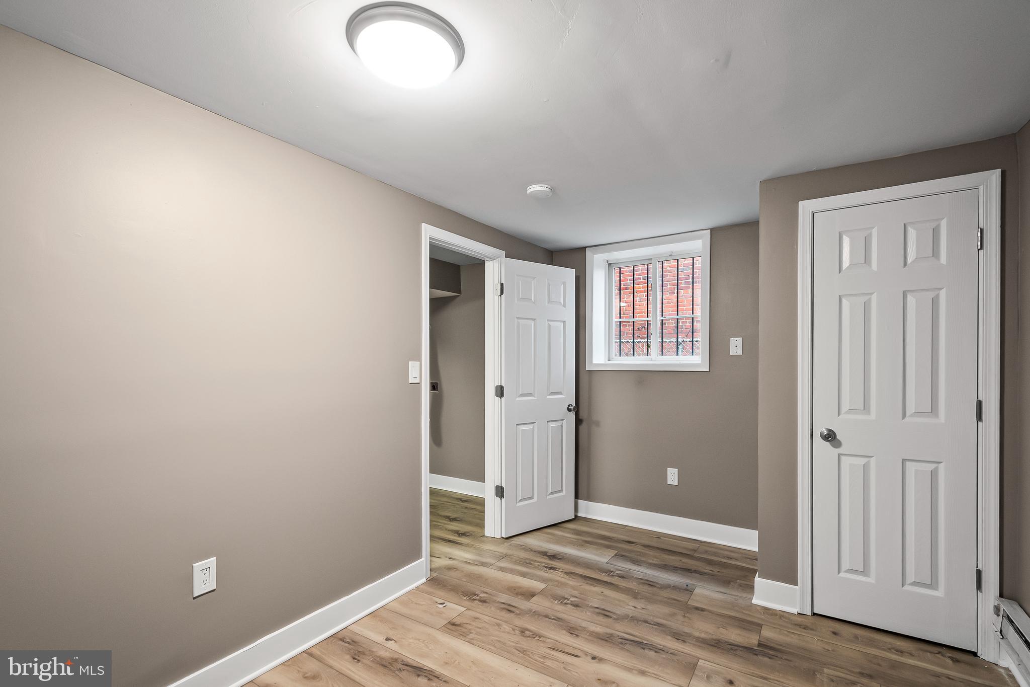 2412 18th Street Southeast Washington, DC 20020 - Photo 26 of 33 an empty room with closet and wooden floor