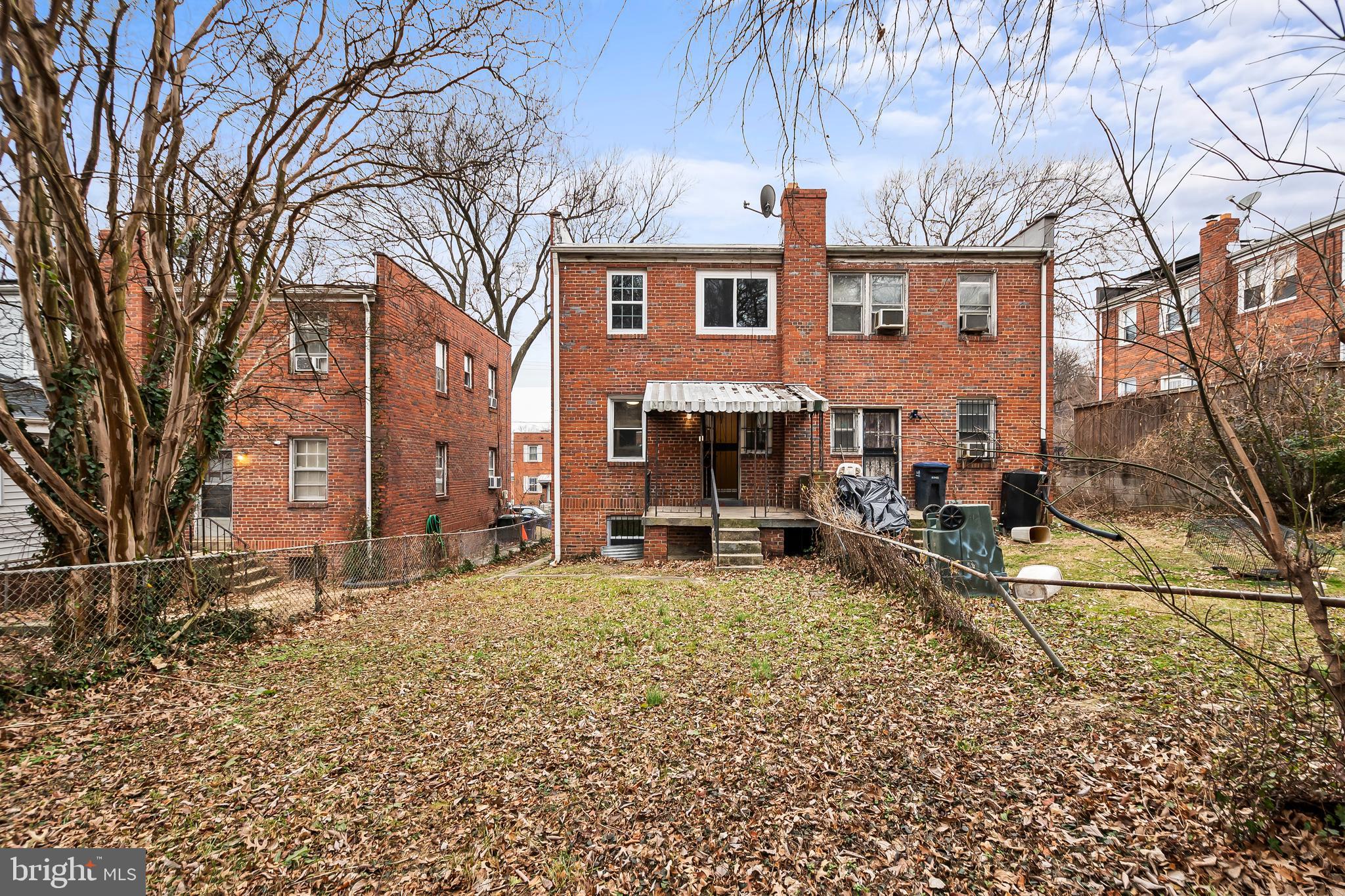 2412 18th Street Southeast Washington, DC 20020 - Photo 33 of 33 a view of a house with a yard covered in snow