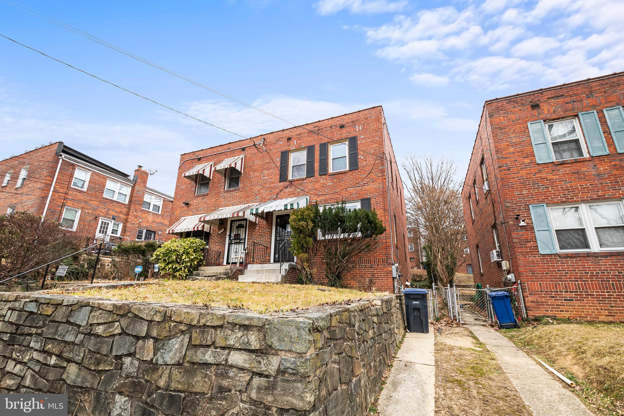 2412 18th Street Southeast Washington, DC 20020 - Photo 4 of 33 a front view of a building with a yard