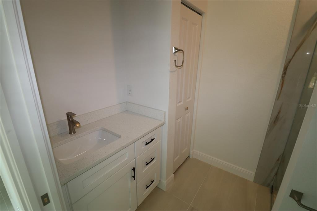 305 Lomond Drive Port Charlotte, FL 33953 - Photo 6 of 12 a bathroom with a granite countertop sink