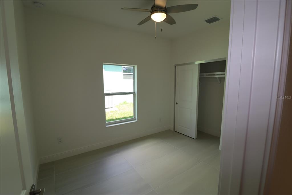 305 Lomond Drive Port Charlotte, FL 33953 - Photo 9 of 12 an empty room with windows