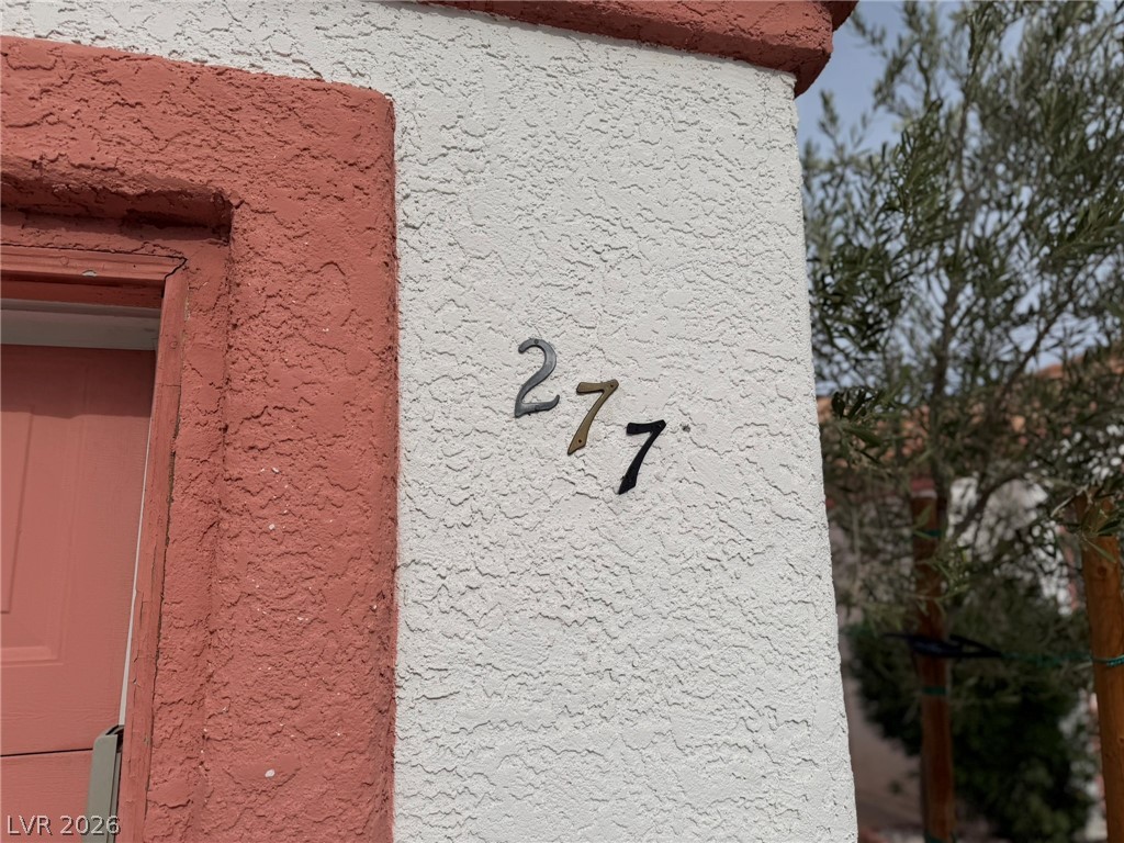 277 Gentle Bay Avenue Henderson, NV 89074 - Photo 3 of 43 The home showcases a textured exterior with clear address numbering.