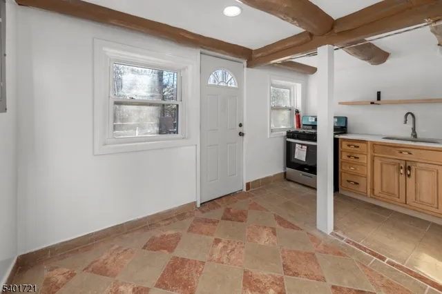 a bedroom with bed and a window