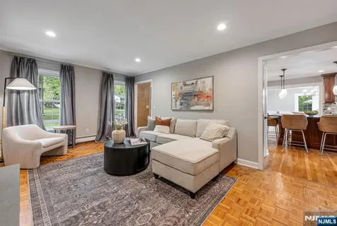 a living room with furniture and a table