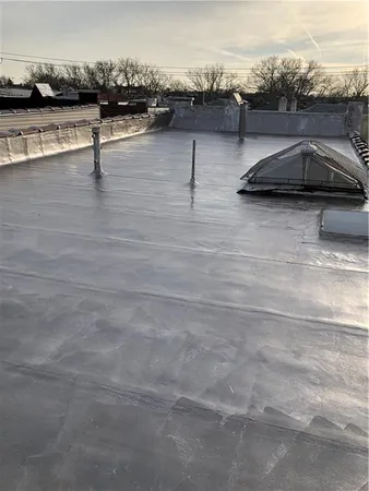 a view of roof deck with patio