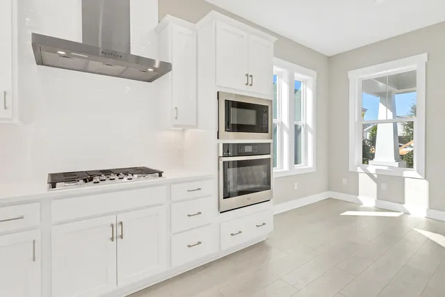 a kitchen with cabinets and white appliances