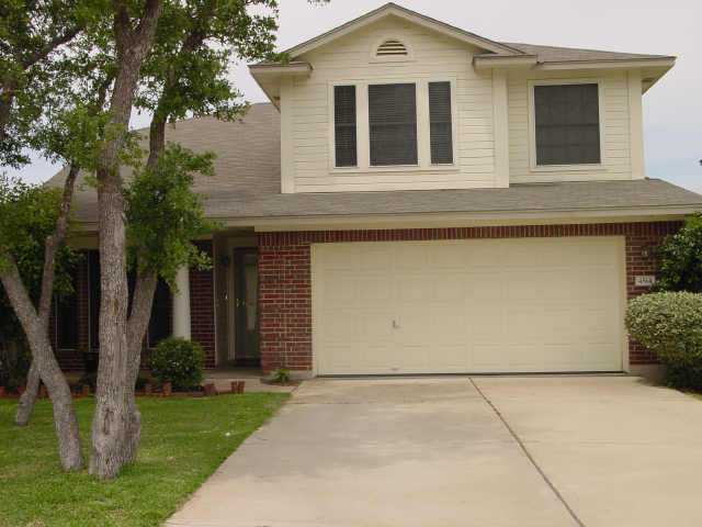 4514 Corran Ferry Loop Austin, TX 78749 - Photo 1 of 1 a front view of a house with garden