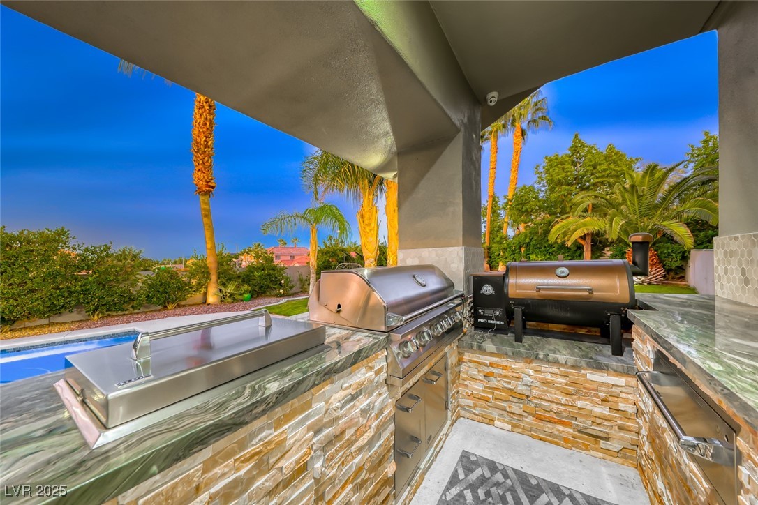 2309 Prometheus Court Henderson, NV 89074 - Photo 62 of 70 View of patio / terrace featuring an outdoor kitchen and an outdoor pool