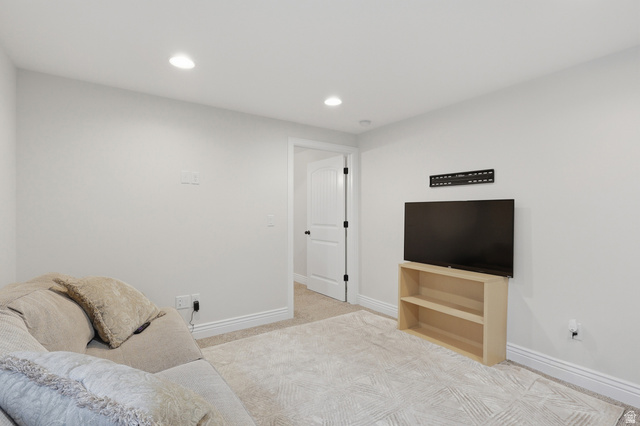 10676 Urban Rdg Cove South Jordan, UT 84095 - Photo 17 of 48 Recessed lighting illuminates this versatile space featuring light-colored walls and carpeted flooring