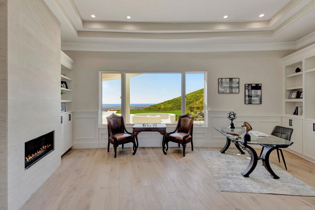 8025 La Milla Rancho Santa Fe, CA 92067 - Photo 11 of 51 a living room with furniture and a fireplace