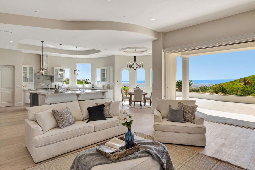 8025 La Milla Rancho Santa Fe, CA 92067 - Photo 19 of 51 a living room with furniture and a large window