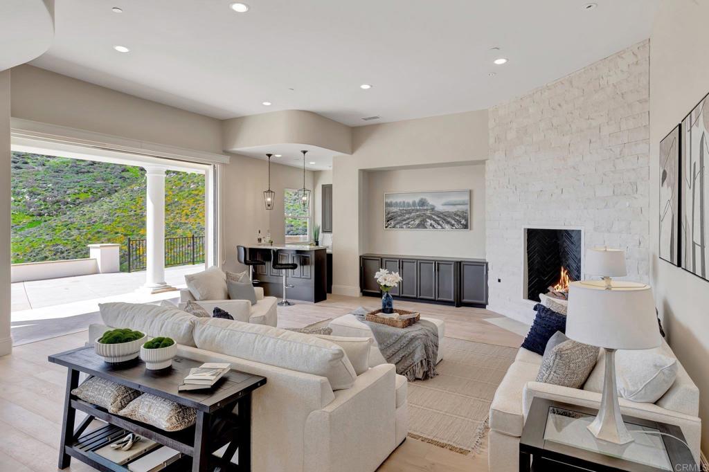 8025 La Milla Rancho Santa Fe, CA 92067 - Photo 20 of 51 a living room with furniture and a large window