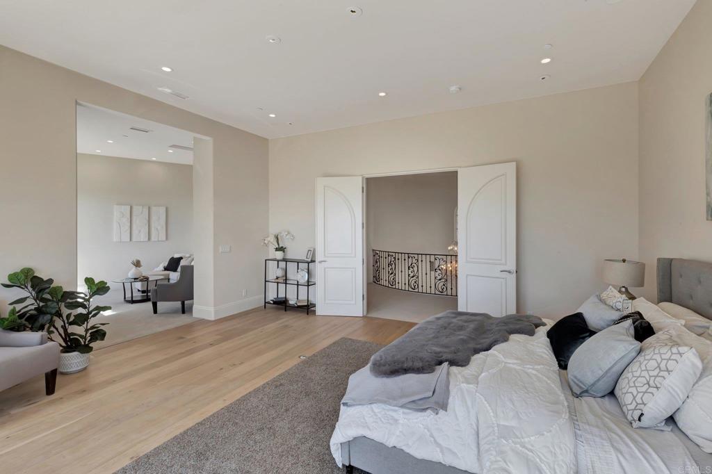 8025 La Milla Rancho Santa Fe, CA 92067 - Photo 24 of 51 a bedroom with a bed and a couch