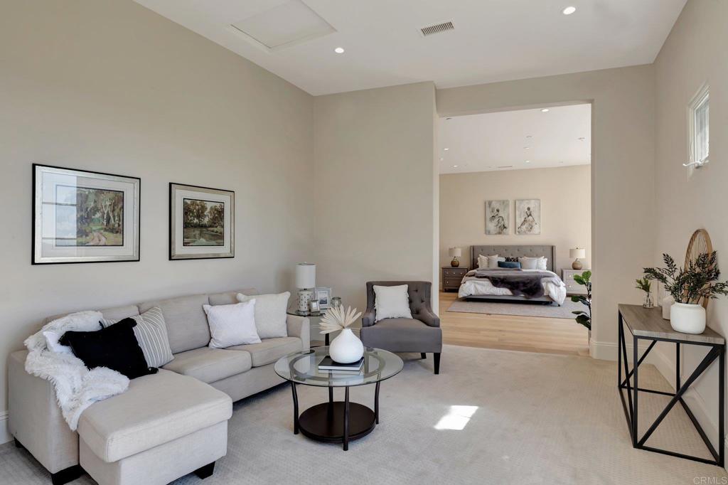 8025 La Milla Rancho Santa Fe, CA 92067 - Photo 25 of 51 a living room with furniture and a potted plant on table