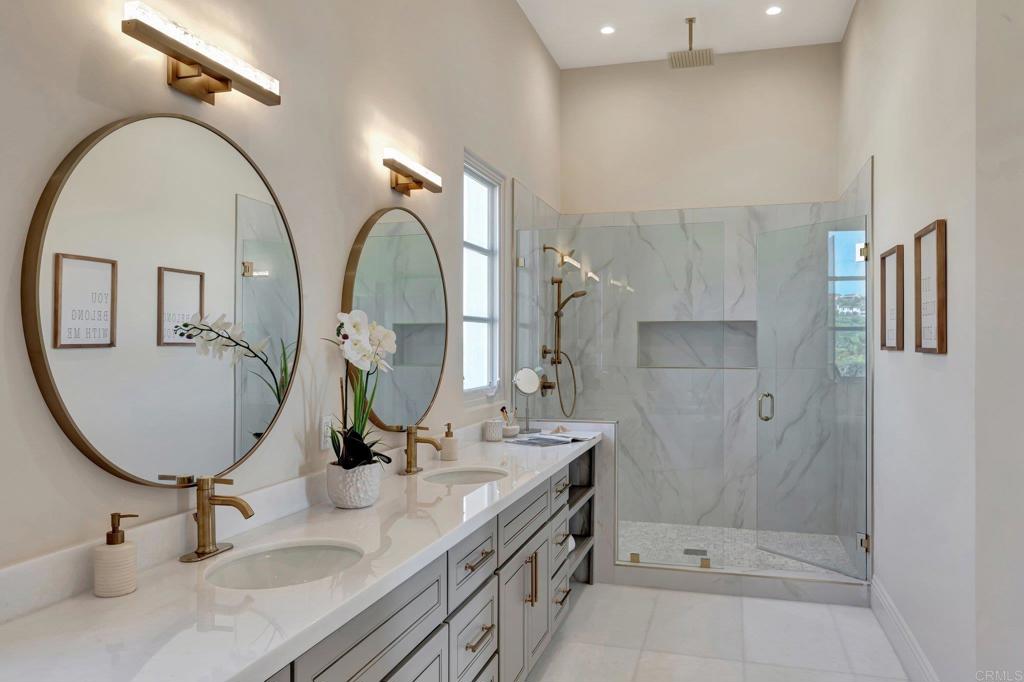 8025 La Milla Rancho Santa Fe, CA 92067 - Photo 34 of 51 a bathroom with a granite countertop sink a mirror and shower