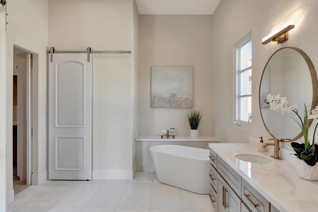 8025 La Milla Rancho Santa Fe, CA 92067 - Photo 35 of 51 a bathroom with a tub sink double vanity and mirror