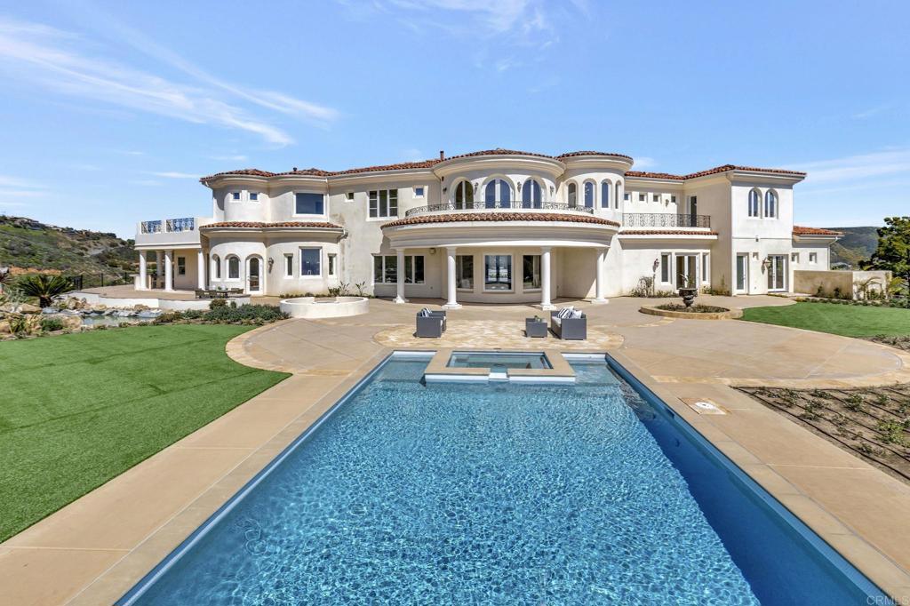 8025 La Milla Rancho Santa Fe, CA 92067 - Photo 44 of 51 a view of a house with a swimming pool