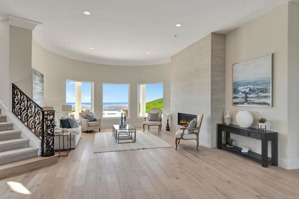8025 La Milla Rancho Santa Fe, CA 92067 - Photo 7 of 51 a living room with furniture and a wooden floor