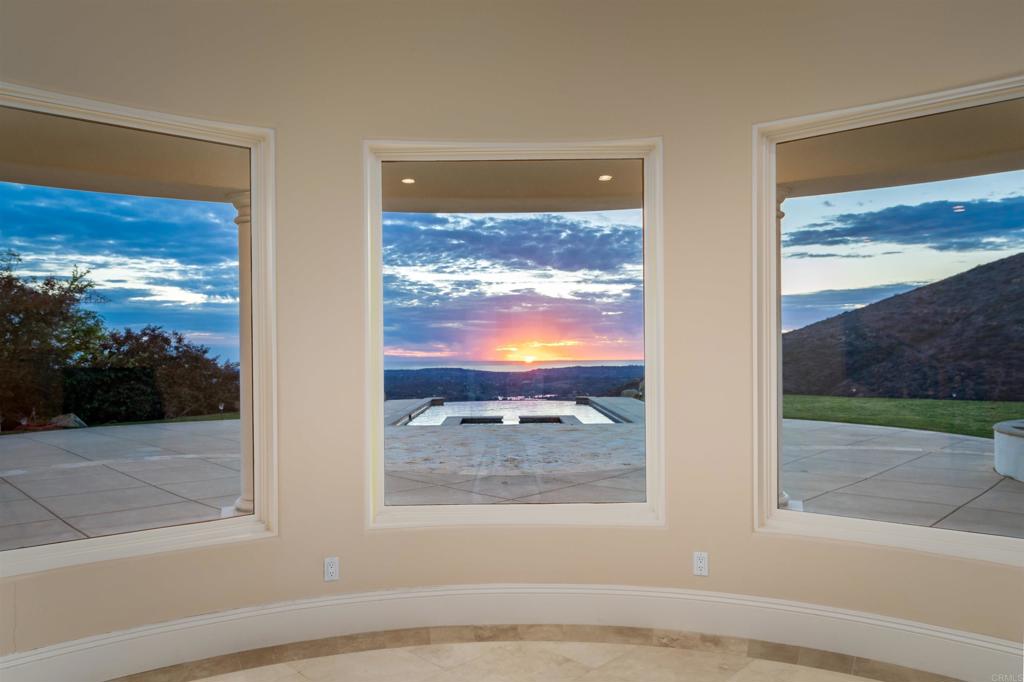 8025 La Milla Rancho Santa Fe, CA 92067 - Photo 8 of 51 a view of a glass door with a tv screen