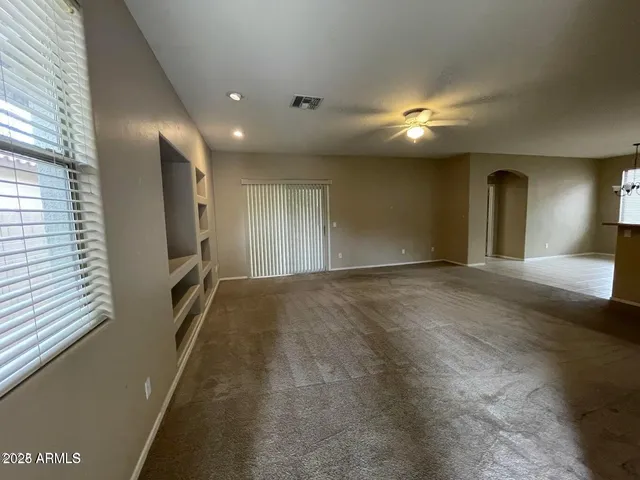 a view of a hallway with windows