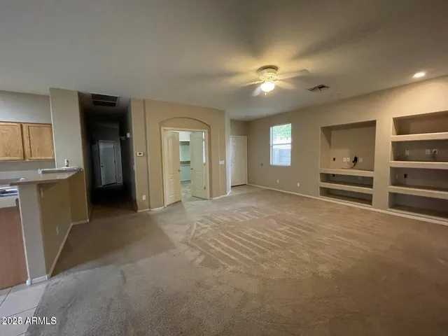 a view of a kitchen with a sink and a refrigerator