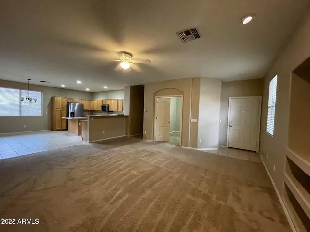 a view of a livingroom with a kitchen