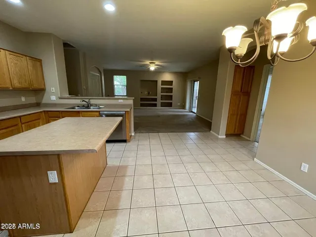 a view of a kitchen with a sink and cabinets
