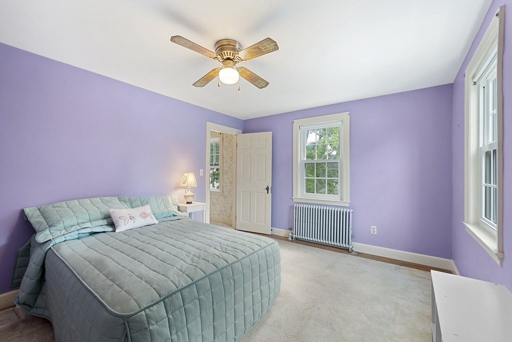 41 Sevinor Road Marblehead, MA 01945 - Photo 16 of 30 a bedroom with a bed and a chandelier