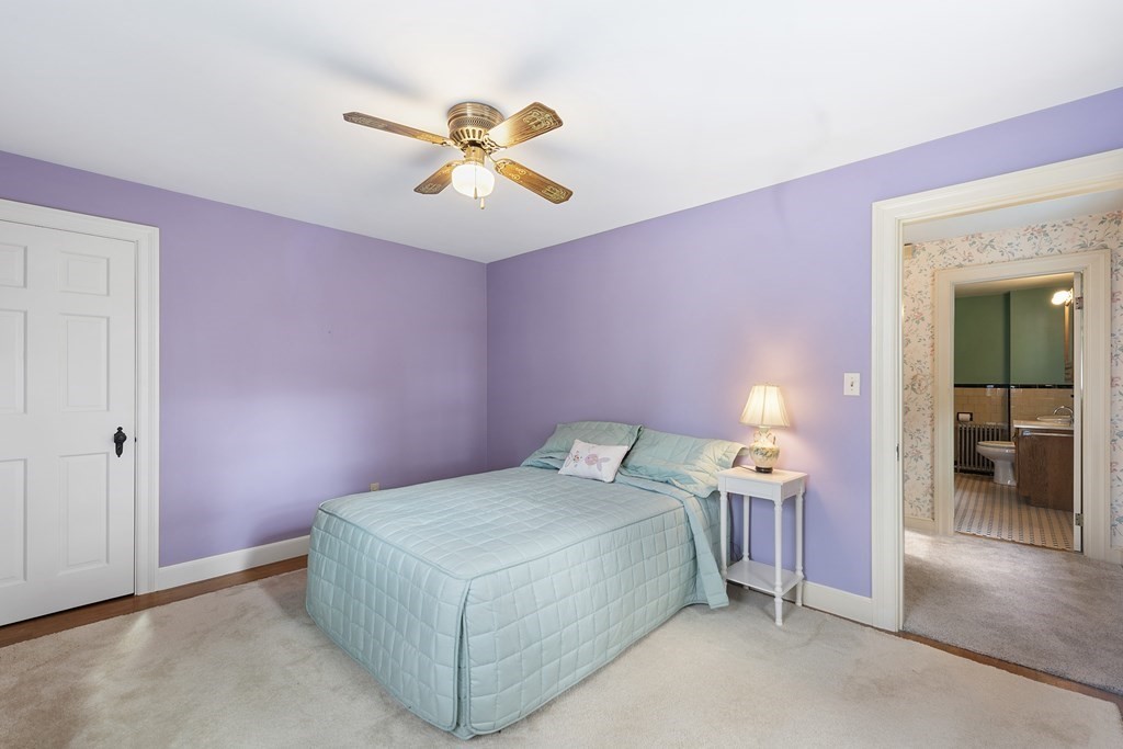 41 Sevinor Road Marblehead, MA 01945 - Photo 17 of 30 a bedroom with a bed and a chandelier